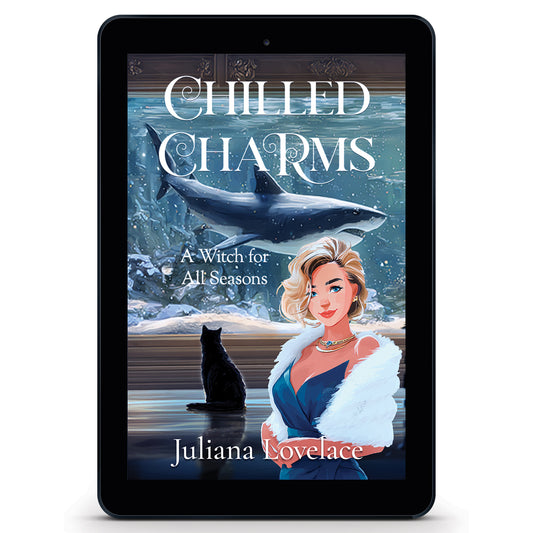 Ebook cover of 'Chilled Charms' by Juliana Lovelace, a witchy paranormal cozy mystery featuring a blonde woman in an elegant blue dress with a fur wrap and a black cat sitting in front of a floor to ceiling aquarium within which swims a large gray shark.